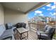 Outdoor patio featuring comfortable seating and a table with a view of the neighborhood at 9590 Sedalia St, Commerce City, CO 80022