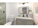 Stylish bathroom with a gray vanity, modern fixtures, and a glass-enclosed shower at 192 Little Creek Rd, Idaho Springs, CO 80452