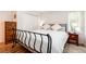 Comfortable bedroom with a black metal bed frame, white bedding, and ample natural light at 192 Little Creek Rd, Idaho Springs, CO 80452