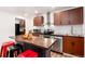 Updated kitchen with stainless steel appliances, stylish cabinets, and island with seating at 192 Little Creek Rd, Idaho Springs, CO 80452