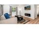 Relaxing living area features a modern fireplace, wood floors, and nature-themed decor at 192 Little Creek Rd, Idaho Springs, CO 80452