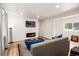 Spacious living room with electric fireplace, wood floors, and recessed lighting at 192 Little Creek Rd, Idaho Springs, CO 80452