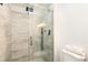 Modern shower featuring sleek tile work, a glass door, and contemporary fixtures at 192 Little Creek Rd, Idaho Springs, CO 80452