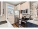 Modern kitchen featuring stainless steel appliances, sleek countertops, and great natural light at 2925 E 14Th Ave, Denver, CO 80206