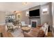 Inviting living room featuring hardwood floors, a cozy fireplace, and lots of natural light at 2925 E 14Th Ave, Denver, CO 80206