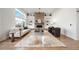 Bright living room featuring a brick fireplace, built-in shelves, and modern furnishings at 3485 S Clermont St, Denver, CO 80222