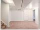 Unfinished basement with low ceilings, carpet flooring, with mechanical elements visible overhead at 8721 E Cornell Dr, Denver, CO 80231