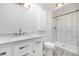 A newly remodeled bathroom with white vanity, shower, and modern fixtures at 8721 E Cornell Dr, Denver, CO 80231