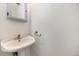 Small bathroom featuring a pedestal sink and towel rack, very simple design at 8721 E Cornell Dr, Denver, CO 80231