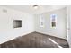 Bedroom featuring a large window for natural light and neutral-colored carpeting at 8721 E Cornell Dr, Denver, CO 80231