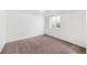 Basement bedroom featuring carpeted floors and a single window for natural light at 8721 E Cornell Dr, Denver, CO 80231