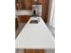 Close up of a kitchen island with sink and countertop at 8721 E Cornell Dr, Denver, CO 80231