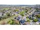 Overhead view of a charming residential area showcasing tree-lined streets and inviting home exteriors at 5977 S Rock Creek Dr, Castle Rock, CO 80109