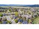 Picturesque aerial view of a residential neighborhood with mountain views and well-maintained landscaping at 5977 S Rock Creek Dr, Castle Rock, CO 80109
