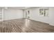 Spacious basement with wood-style flooring, ample natural light from doors and a window, and neutral color palette at 5977 S Rock Creek Dr, Castle Rock, CO 80109