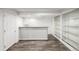 Finished basement area with bar, display cases, wood flooring, and neutral tones, ideal for entertaining or relaxing at 5977 S Rock Creek Dr, Castle Rock, CO 80109