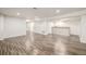 Expansive finished basement offers versatile living space with recessed lighting, and stylish wood-style floors at 5977 S Rock Creek Dr, Castle Rock, CO 80109