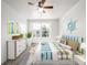 Bright bedroom with a fun nautical theme, large window, and ceiling fan at 5977 S Rock Creek Dr, Castle Rock, CO 80109
