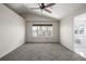 Spacious bedroom with carpet and a large window overlooking a residential street at 5977 S Rock Creek Dr, Castle Rock, CO 80109