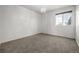 Cozy bedroom with carpet, one window, and a modern light fixture at 5977 S Rock Creek Dr, Castle Rock, CO 80109