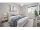 Cozy bedroom featuring a queen-sized bed, soft lighting, and serene ambiance at 5977 S Rock Creek Dr, Castle Rock, CO 80109