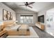 Modern bedroom with vaulted ceiling, large window, and en-suite bathroom at 5977 S Rock Creek Dr, Castle Rock, CO 80109
