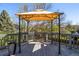 View of the deck with gazebo and gray wood flooring overlooking the yard at 5977 S Rock Creek Dr, Castle Rock, CO 80109