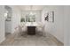 Formal dining area featuring a modern table, seating for eight, and natural light at 5977 S Rock Creek Dr, Castle Rock, CO 80109