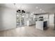 Open kitchen featuring white cabinets, subway tile backsplash, stainless steel appliances and french doors at 5977 S Rock Creek Dr, Castle Rock, CO 80109