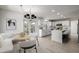 Bright kitchen featuring white cabinets, stainless appliances, and cozy breakfast nook at 5977 S Rock Creek Dr, Castle Rock, CO 80109