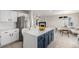 Open concept kitchen with stainless steel appliances and a stylish center island at 5977 S Rock Creek Dr, Castle Rock, CO 80109