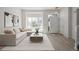 Bright living room with large window, hardwood floors, and neutral decor at 5977 S Rock Creek Dr, Castle Rock, CO 80109