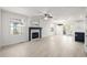 Bright living room with a fireplace, a ceiling fan, and sliding doors to the outside at 5977 S Rock Creek Dr, Castle Rock, CO 80109