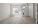Bright living room featuring large windows, light wood floors, neutral walls and abundant natural light at 5977 S Rock Creek Dr, Castle Rock, CO 80109