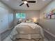 Cozy bedroom with natural light, ceiling fan and wood-look floors at 1250 S Monaco Pkwy # 17, Denver, CO 80224