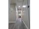 Hallway with gray flooring, white trim and doors, and recessed lighting at 1250 S Monaco Pkwy # 17, Denver, CO 80224
