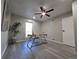 Well-lit home office space with gray flooring, a ceiling fan and modern desk at 1250 S Monaco Pkwy # 17, Denver, CO 80224