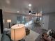 Cozy living area with open floor plan, modern lighting, and neutral color scheme at 1250 S Monaco Pkwy # 17, Denver, CO 80224