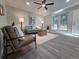 Bright living room features large windows, neutral tones, and stylish furnishings at 1250 S Monaco Pkwy # 17, Denver, CO 80224