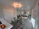 Inviting open-plan living space with modern light fixtures and comfortable seating at 1250 S Monaco Pkwy # 17, Denver, CO 80224