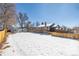 Large backyard with a wooden fence and a detached garage at 2918 Ames St, Wheat Ridge, CO 80214