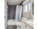 Bathroom featuring bathtub, shower, toilet, and granite vanity at 2918 Ames St, Wheat Ridge, CO 80214