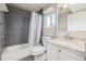 Bathroom featuring bathtub, shower, toilet, and granite vanity at 2918 Ames St, Wheat Ridge, CO 80214