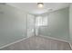 Light blue bedroom with carpet floors and natural light at 2918 Ames St, Wheat Ridge, CO 80214