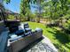 Lush backyard with outdoor seating area, hot tub, and well-maintained lawn for peaceful enjoyment at 10774 Chadsworth Ln, Highlands Ranch, CO 80126