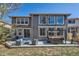 Backyard with patio seating and a hot tub at 10774 Chadsworth Ln, Highlands Ranch, CO 80126