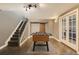 Finished basement game area with foosball table, access to the stairs, and a closet with barn door at 10774 Chadsworth Ln, Highlands Ranch, CO 80126