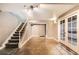 Unfurnished basement offering flexible space, staircase to the main floor, and French doors to a private room at 10774 Chadsworth Ln, Highlands Ranch, CO 80126