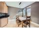 Cozy dining area with a modern pendant light fixture at 10774 Chadsworth Ln, Highlands Ranch, CO 80126