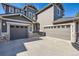 Two-story home with a three-car garage and stone accents at 10774 Chadsworth Ln, Highlands Ranch, CO 80126